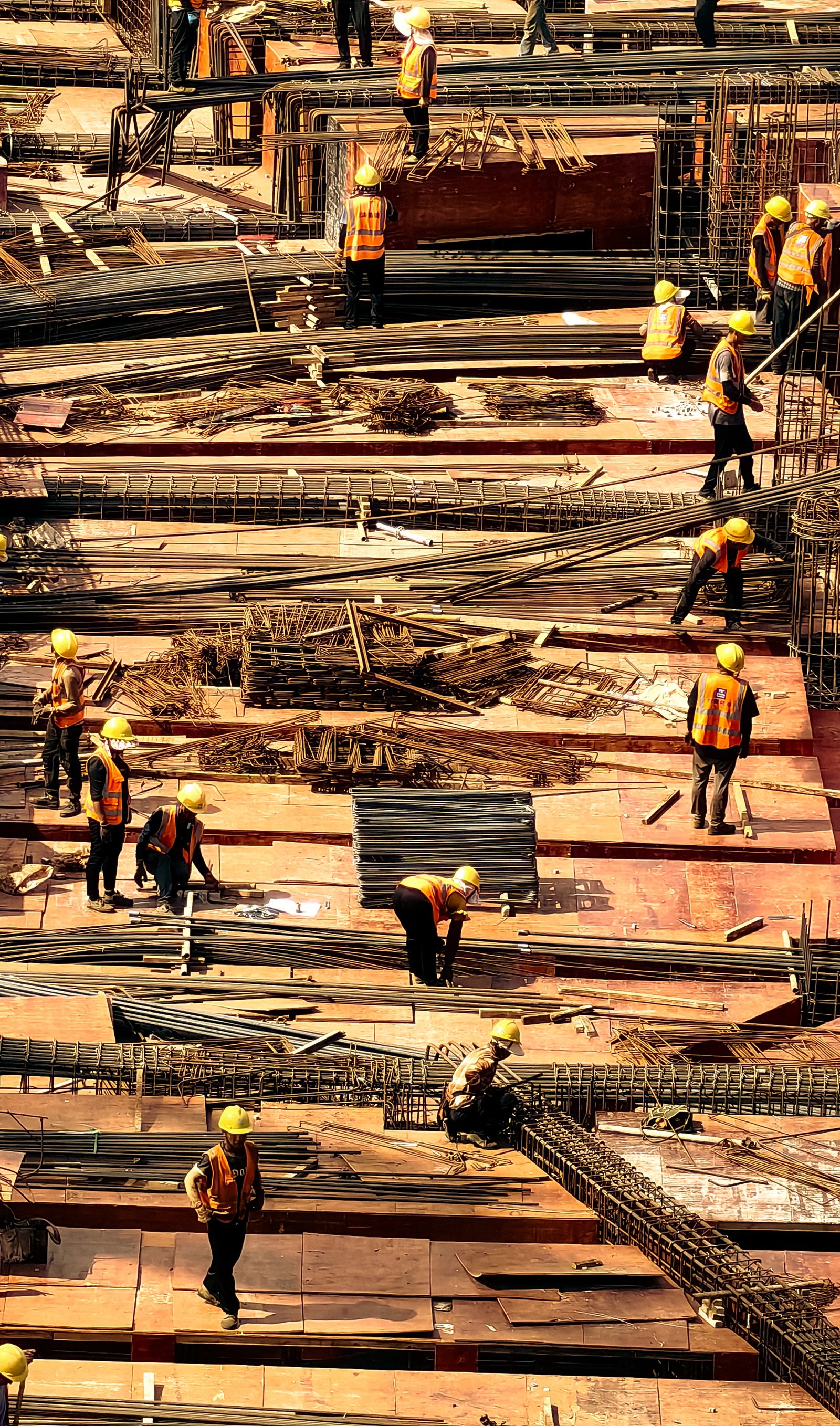 Wide view across a large active construction and infrastructure worksite.